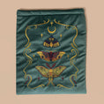 Load image into Gallery viewer, Embroidered velvet fabric with lunar moth designs on a teal background